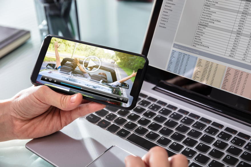 Businessman watching video on phone