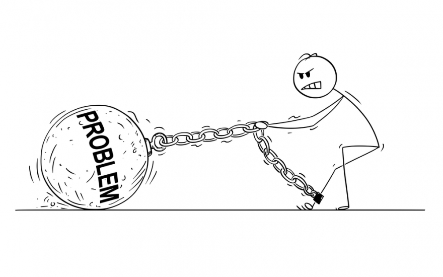 cartoon man dragging a ball on a chain with the word problem written on it