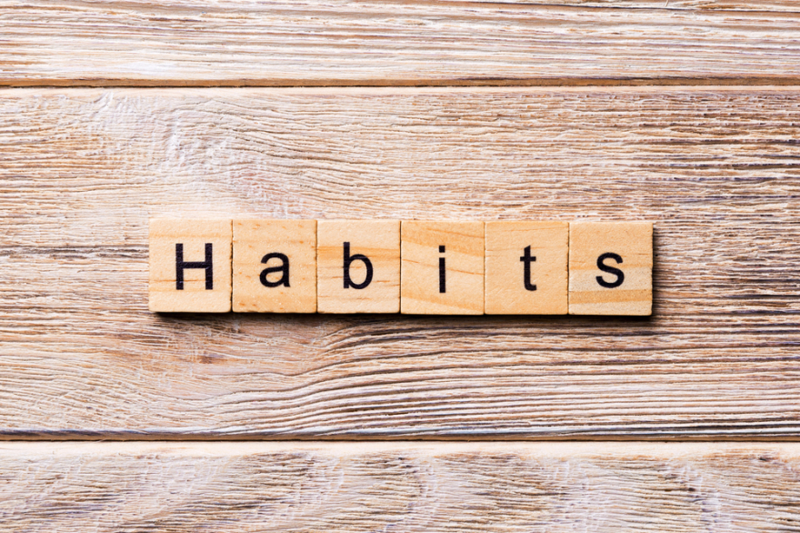 HABITS word written on wood block