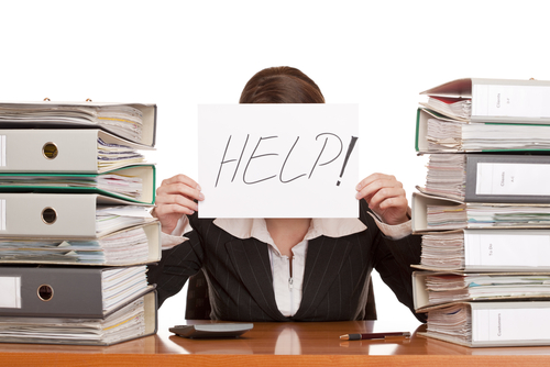 woman holding sign for help