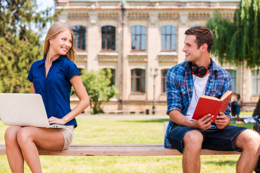 man and woman sitting on a bench