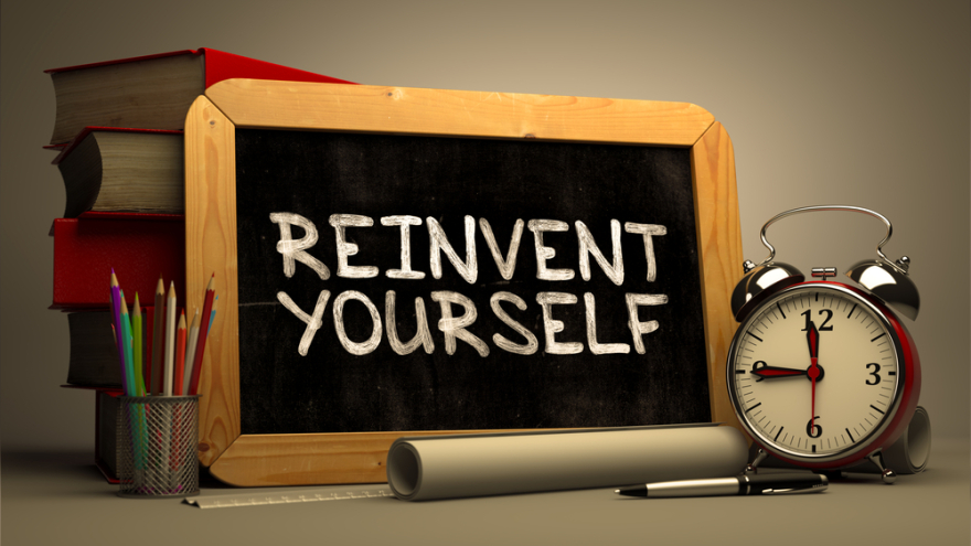 Reinvent Yourself Handwritten on Chalkboard