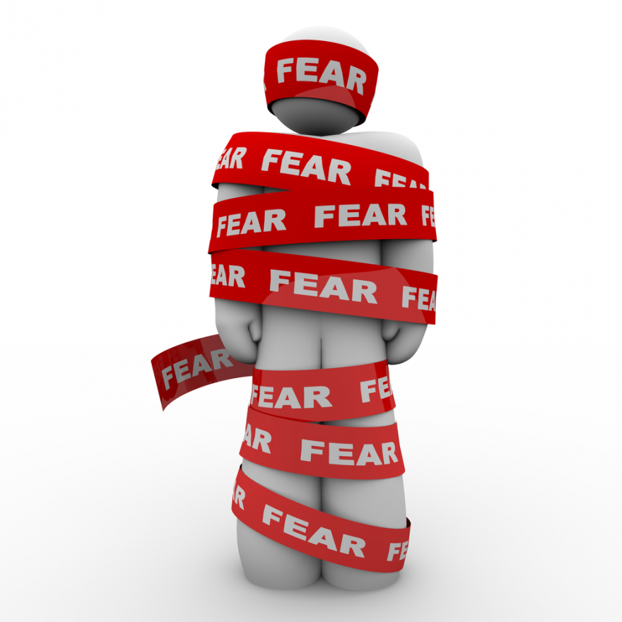 Scared Afraid Man Wrapped in Red Fear Tape