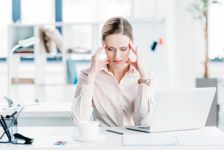 tired business woman at workplace