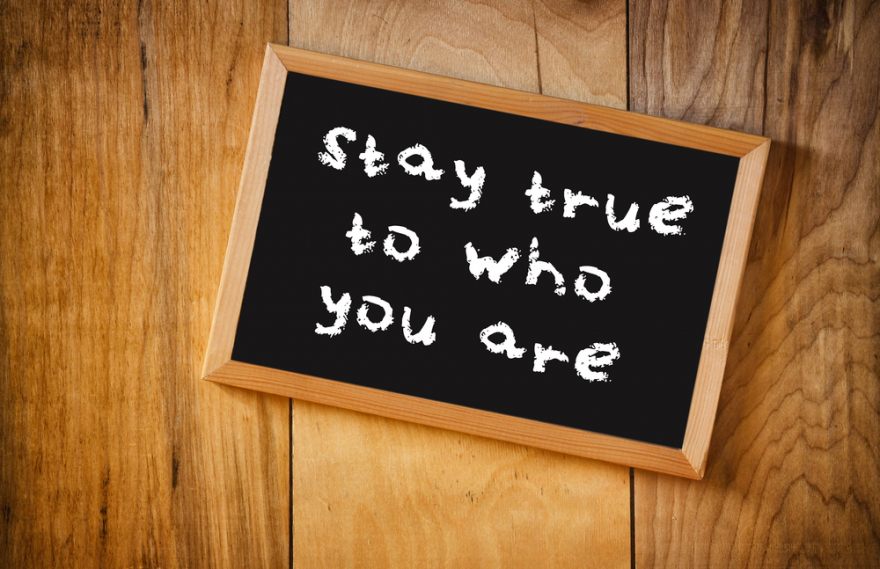top view of blackboard with the phrase stay true to who you are