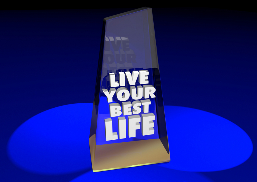 Trophy with words Live Your Best Life on blue background