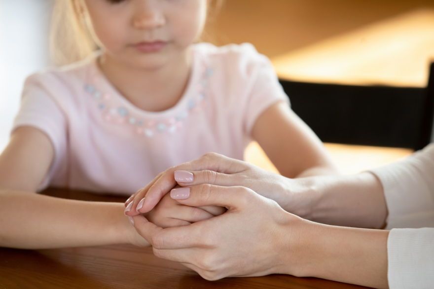 Worried mom showing care, supporting unhappy daughter at home