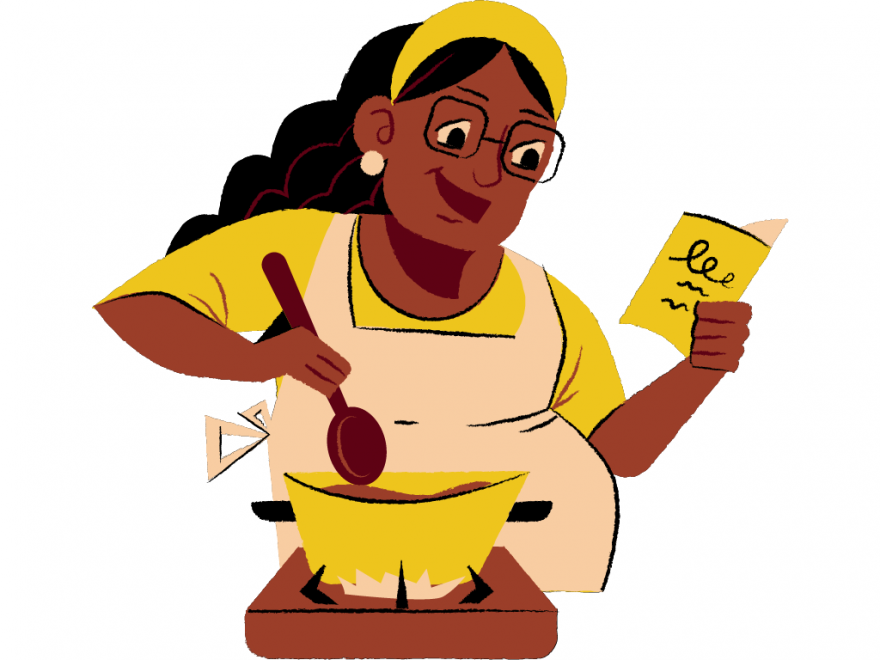 woman reading a recipe and stirring a cooking pot